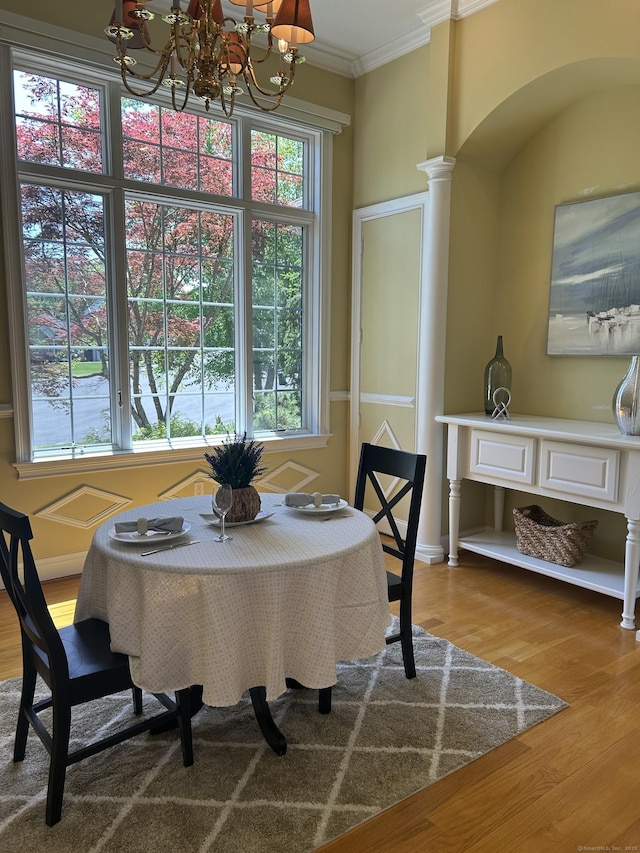 21 Autumn Cir, Rocky Hill, CT 06067 - dining area featuring a chandelier, ornamental molding, wood finished floors, and decorative columns