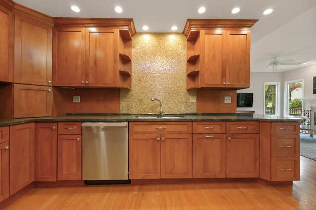 kitchen featuring stainless steel dishwasher, open shelves, a sink, brown cabinetry, and recessed lighting