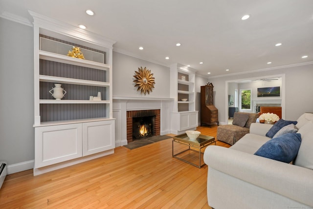 living area with a fireplace, ornamental molding, light wood finished floors, recessed lighting, and baseboards