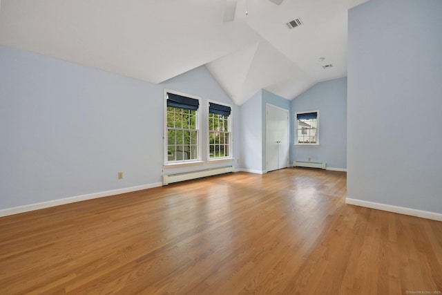 additional living space featuring baseboard heating, ceiling fan, baseboards, and lofted ceiling