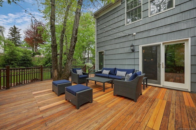 wooden terrace featuring an outdoor living space
