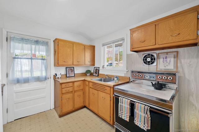 kitchen with range with electric cooktop, a sink, light countertops, lofted ceiling, and light floors