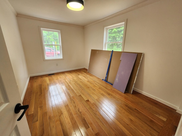 154 Falls Rd, East Haddam, CT 06469 - empty room with hardwood / wood-style flooring, plenty of natural light, and ornamental molding