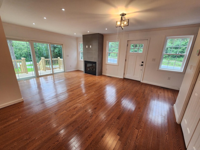 154 Falls Rd, East Haddam, CT 06469 - unfurnished living room with a fireplace, ornamental molding, hardwood / wood-style flooring, and recessed lighting