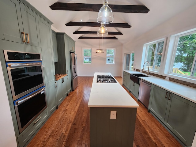 154 Falls Rd, East Haddam, CT 06469 - kitchen featuring stainless steel appliances, a center island, dark wood-style floors, and pendant lighting
