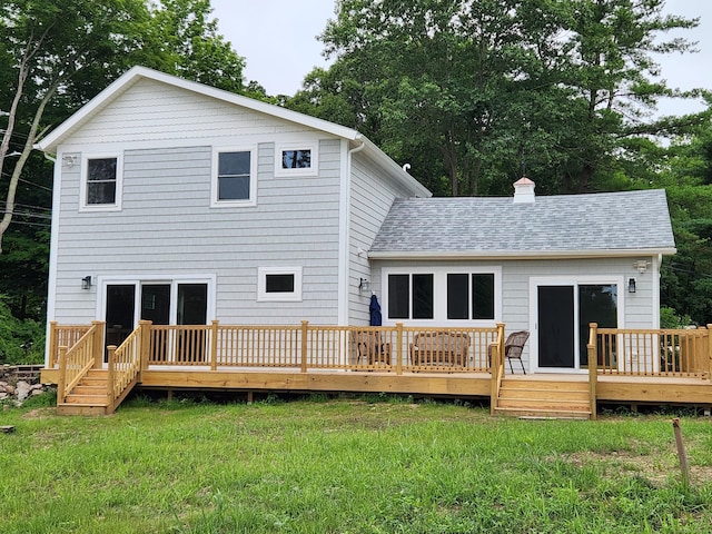 154 Falls Rd, East Haddam, CT 06469 - back of property with a yard, a wooden deck, roof with shingles, and a chimney