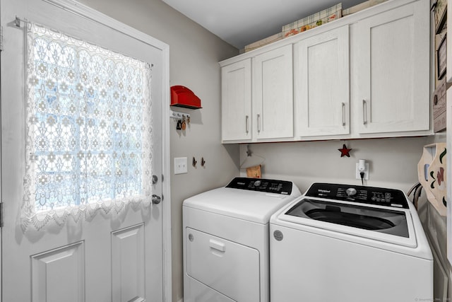 laundry room with cabinet space and independent washer and dryer