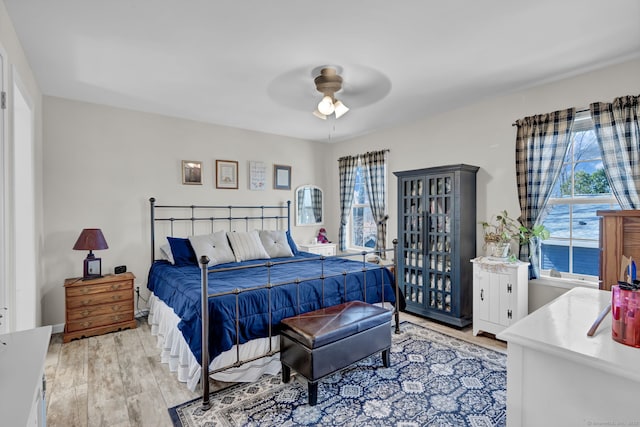 bedroom featuring ceiling fan and light wood-type flooring