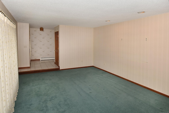 carpeted empty room featuring a baseboard radiator, a textured ceiling, baseboards, and wallpapered walls