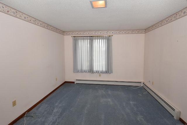 carpeted empty room with a baseboard radiator, baseboards, and a textured ceiling