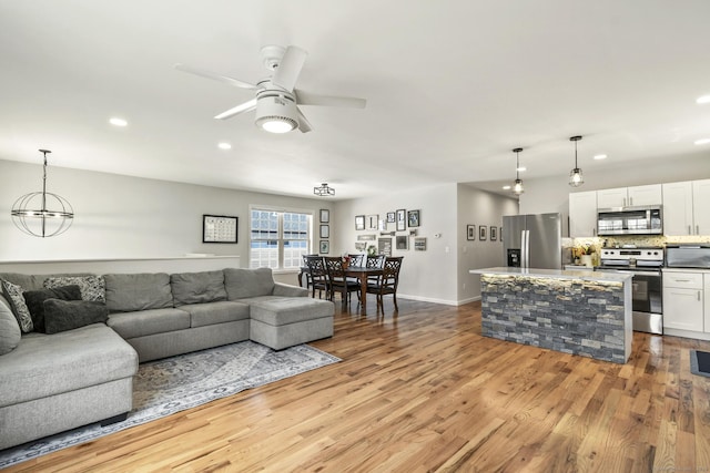 10 Bidwell Ter, Middletown, CT 06457 - living area with recessed lighting, wood finished floors, a ceiling fan, and baseboards