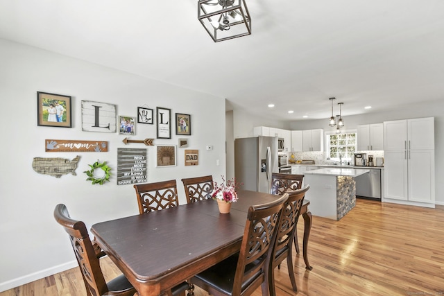 10 Bidwell Ter, Middletown, CT 06457 - dining room featuring recessed lighting, light wood finished floors, baseboards, and an inviting chandelier