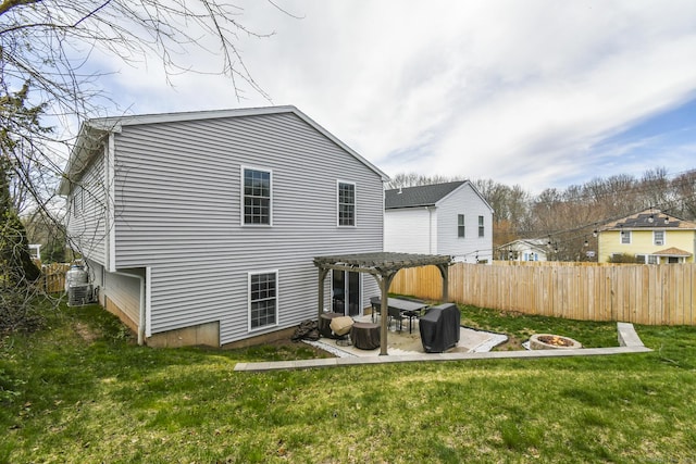 10 Bidwell Ter, Middletown, CT 06457 - back of house featuring fence, a pergola, an outdoor fire pit, and a lawn
