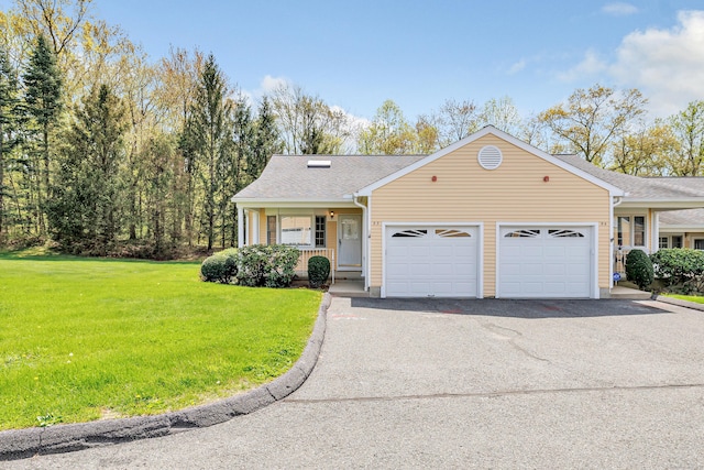 single story home featuring a porch, aphalt driveway, roof with shingles, an attached garage, and a front lawn
