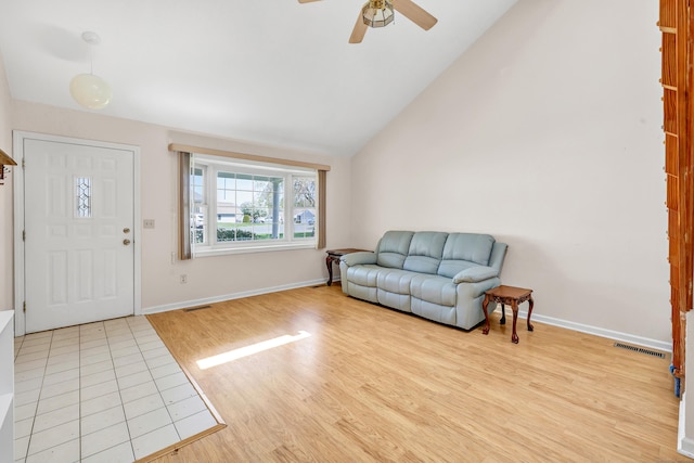 foyer entrance featuring visible vents, wood finished floors, baseboards, and ceiling fan