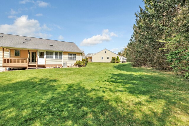 view of yard featuring a deck