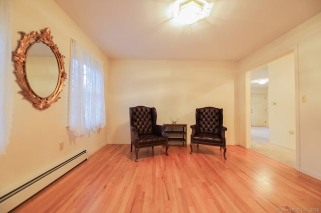 1900 Litchfield Rd, Watertown, CT 06795 - living area featuring baseboard heating, light wood-style floors, and baseboards