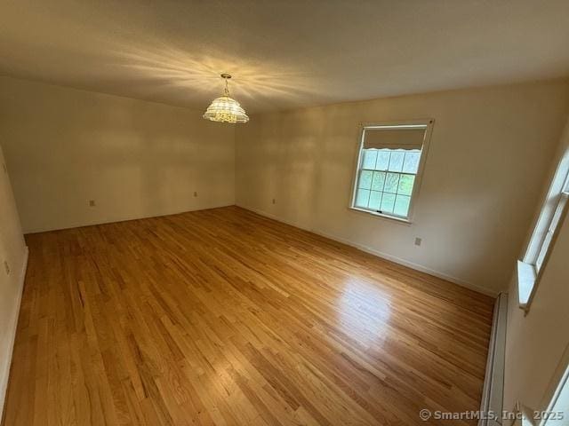 1900 Litchfield Rd, Watertown, CT 06795 - unfurnished room with a chandelier and light wood finished floors