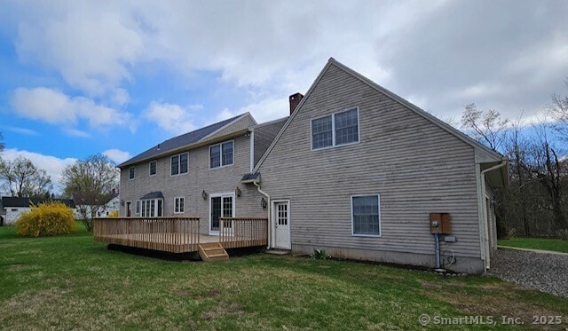 1900 Litchfield Rd, Watertown, CT 06795 - back of house with a chimney, a wooden deck, and a lawn