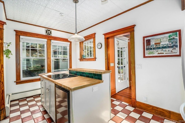 kitchen featuring black electric stovetop, wooden counters, wine cooler, and light floors
