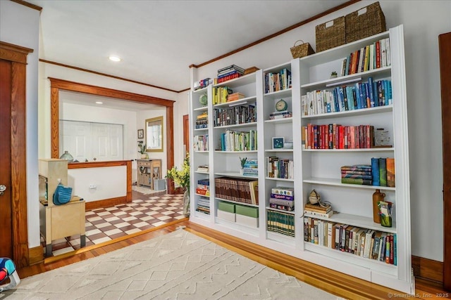 interior space featuring ornamental molding, wood finished floors, and recessed lighting