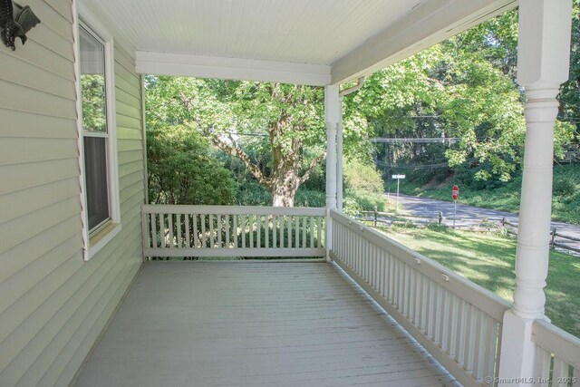 26 Seminary Rd, Simsbury, CT 06070 - wooden porch featuring a yard