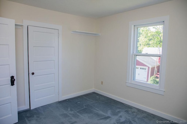 26 Seminary Rd, Simsbury, CT 06070 - spare room featuring dark colored carpet and baseboards