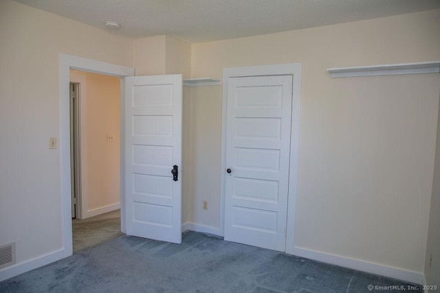 26 Seminary Rd, Simsbury, CT 06070 - unfurnished bedroom with dark carpet and baseboards