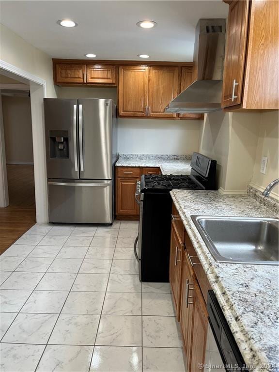 kitchen featuring island exhaust hood, recessed lighting, appliances with stainless steel finishes, a sink, and brown cabinetry