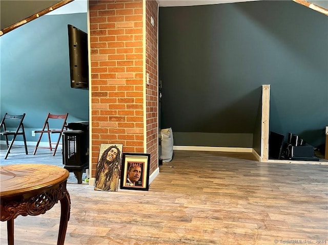 interior space with baseboards and wood finished floors