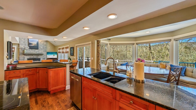 224 Tepi Dr, Southbury, CT 06488 - kitchen with recessed lighting, dark wood-style flooring, dishwasher, a fireplace, and a sink