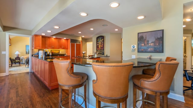 224 Tepi Dr, Southbury, CT 06488 - kitchen with a kitchen breakfast bar, dark wood-type flooring, recessed lighting, and baseboards