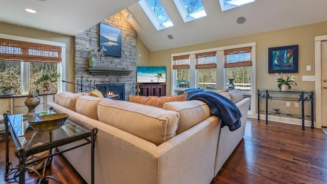 224 Tepi Dr, Southbury, CT 06488 - living room featuring a skylight, a fireplace, dark wood-type flooring, and plenty of natural light