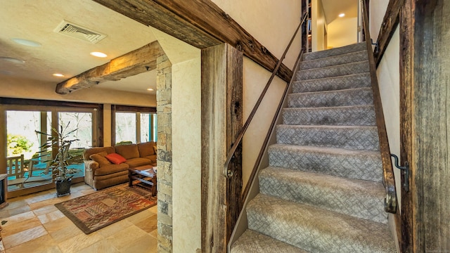 224 Tepi Dr, Southbury, CT 06488 - stairway with visible vents, arched walkways, stone finish flooring, and recessed lighting