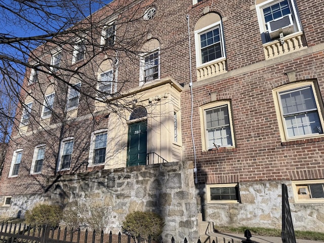 2811 Fairfield Ave Unit 1, Bridgeport, CT 06605 - view of property exterior featuring brick siding and fence