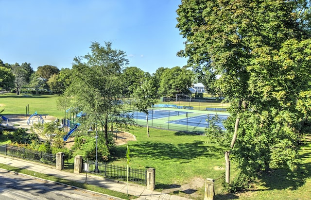2811 Fairfield Ave Unit 1, Bridgeport, CT 06605 - view of tennis court featuring view of wooded area