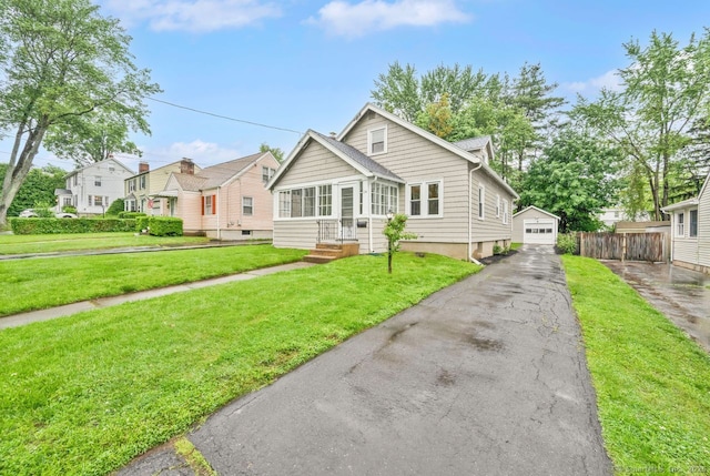 134 Saint Charles St, West Hartford, CT 06119 - bungalow with a garage, an outbuilding, and driveway