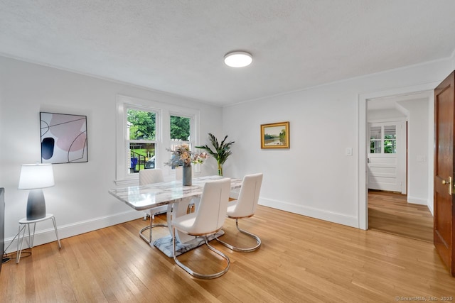 134 Saint Charles St, West Hartford, CT 06119 - dining area featuring light wood-style flooring and baseboards