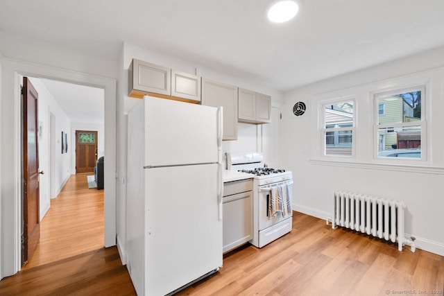 134 Saint Charles St, West Hartford, CT 06119 - kitchen with white appliances, radiator, light wood finished floors, and baseboards