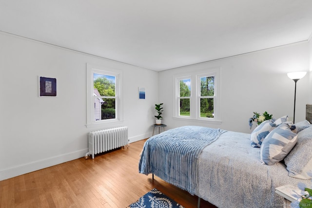 134 Saint Charles St, West Hartford, CT 06119 - bedroom featuring radiator, baseboards, and light wood-style floors