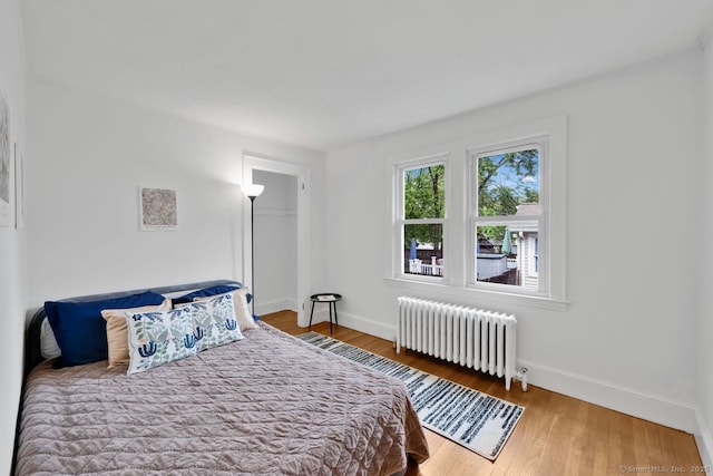 134 Saint Charles St, West Hartford, CT 06119 - bedroom featuring radiator heating unit, baseboards, and wood finished floors
