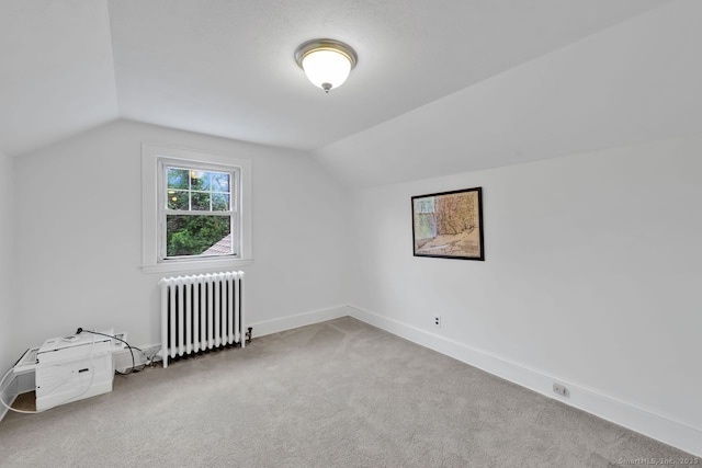 134 Saint Charles St, West Hartford, CT 06119 - additional living space with radiator, lofted ceiling, carpet floors, and baseboards
