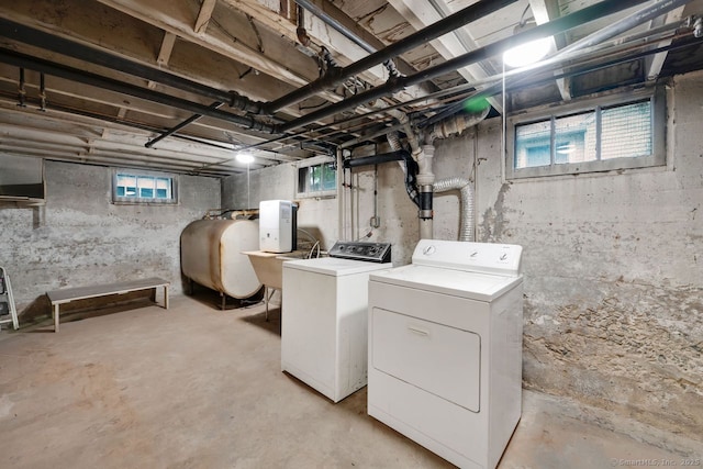 134 Saint Charles St, West Hartford, CT 06119 - laundry area featuring oil tank and washer and clothes dryer