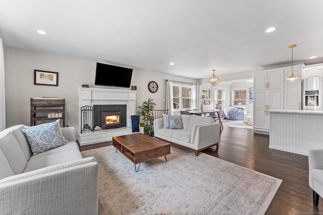 21 White Birch Rd, Redding, CT 06896 - living room featuring dark wood-style flooring, baseboards, a glass covered fireplace, and recessed lighting