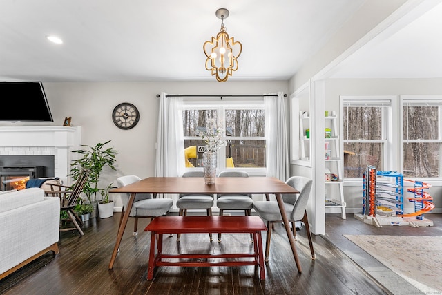 21 White Birch Rd, Redding, CT 06896 - dining space featuring a chandelier, wood finished floors, a brick fireplace, and recessed lighting