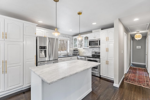 21 White Birch Rd, Redding, CT 06896 - kitchen featuring glass insert cabinets, white cabinets, dark wood-style flooring, appliances with stainless steel finishes, and tasteful backsplash