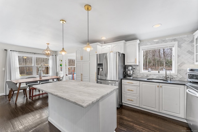 21 White Birch Rd, Redding, CT 06896 - kitchen with white cabinets, a wealth of natural light, appliances with stainless steel finishes, and a sink
