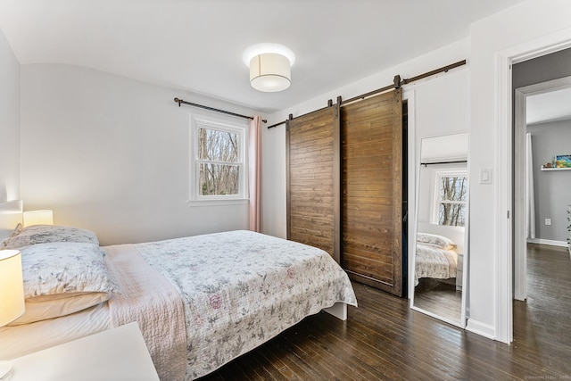 21 White Birch Rd, Redding, CT 06896 - bedroom featuring baseboards, wood-type flooring, and a barn door