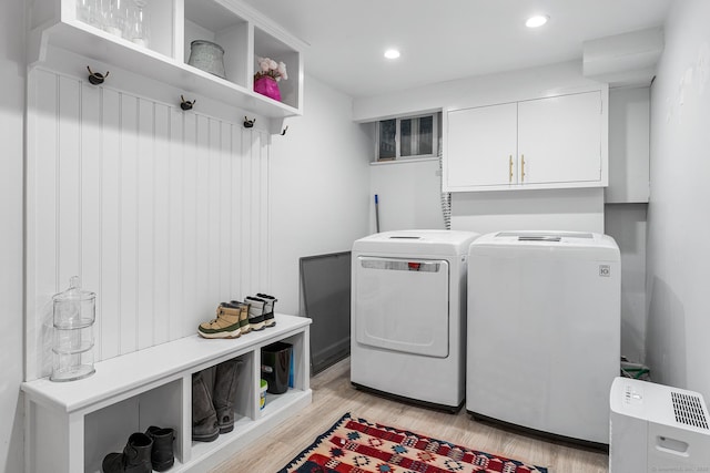 21 White Birch Rd, Redding, CT 06896 - washroom with light wood finished floors, washer and dryer, recessed lighting, and cabinet space
