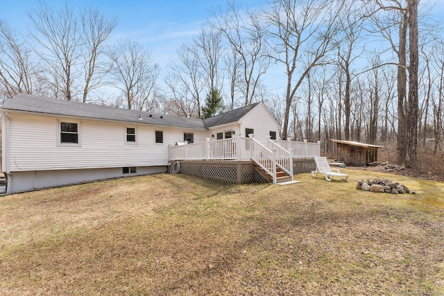 21 White Birch Rd, Redding, CT 06896 - rear view of house with an outdoor fire pit, stairway, a wooden deck, and a lawn